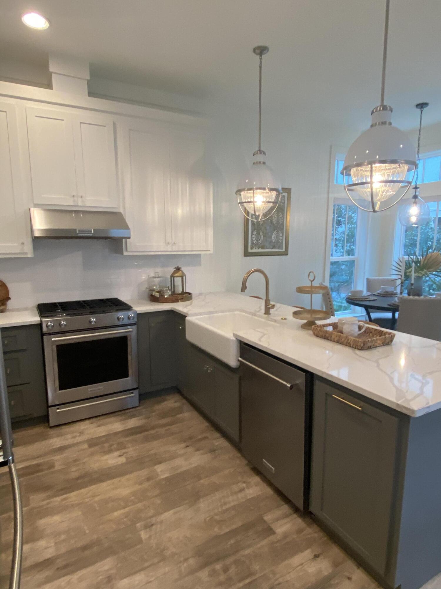 8 Lazy Day Ln Inlet Beach Inlet Beach, FL 32461 - Photo 7 of 13 a kitchen with a sink stove and cabinets