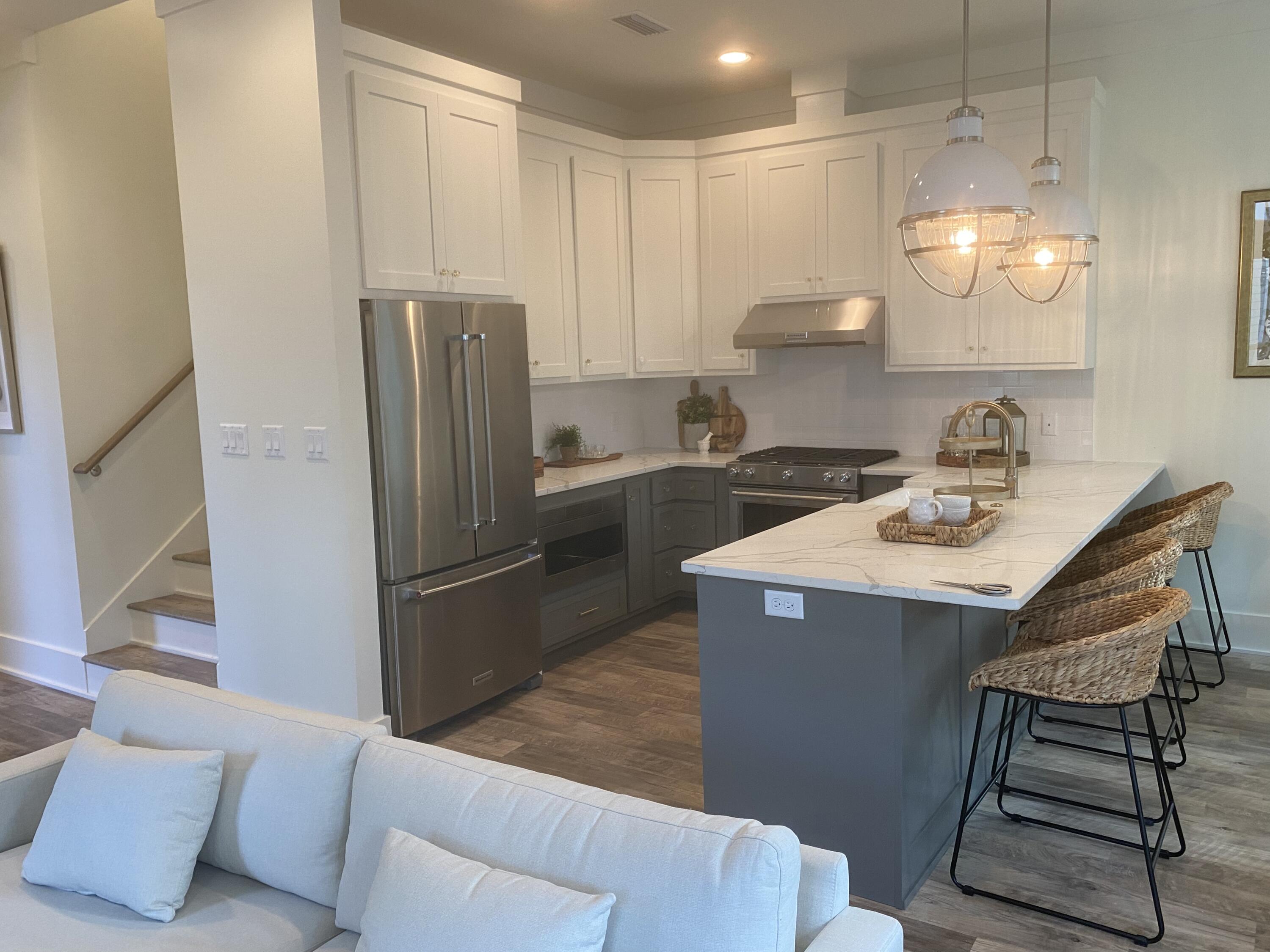 8 Lazy Day Ln Inlet Beach Inlet Beach, FL 32461 - Photo 8 of 13 a kitchen with stainless steel appliances granite countertop a sink a refrigerator and a stove