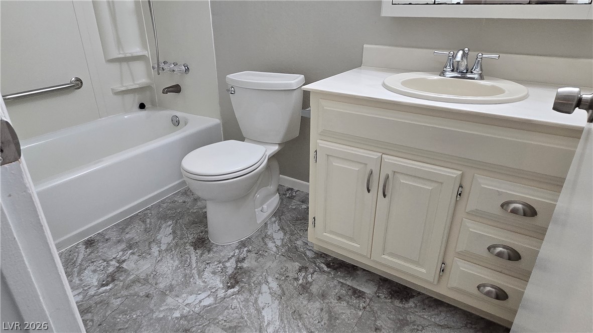 3849 Reflection Way Las Vegas, NV 89147 - Photo 13 of 25 This bathroom features a sleek vanity with a classic basin, offering practicality and design.