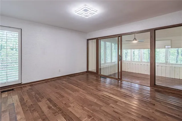 a view of a livingroom with an empty space and a window