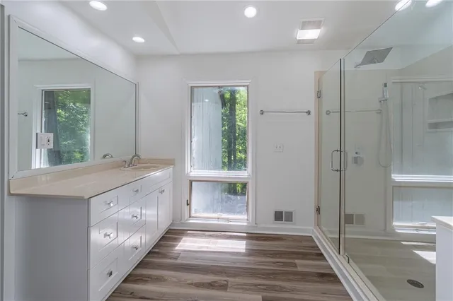 an empty room with closet and a chandelier fan