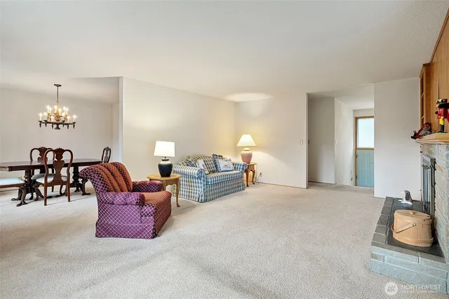 a bed room with furniture and a lamp