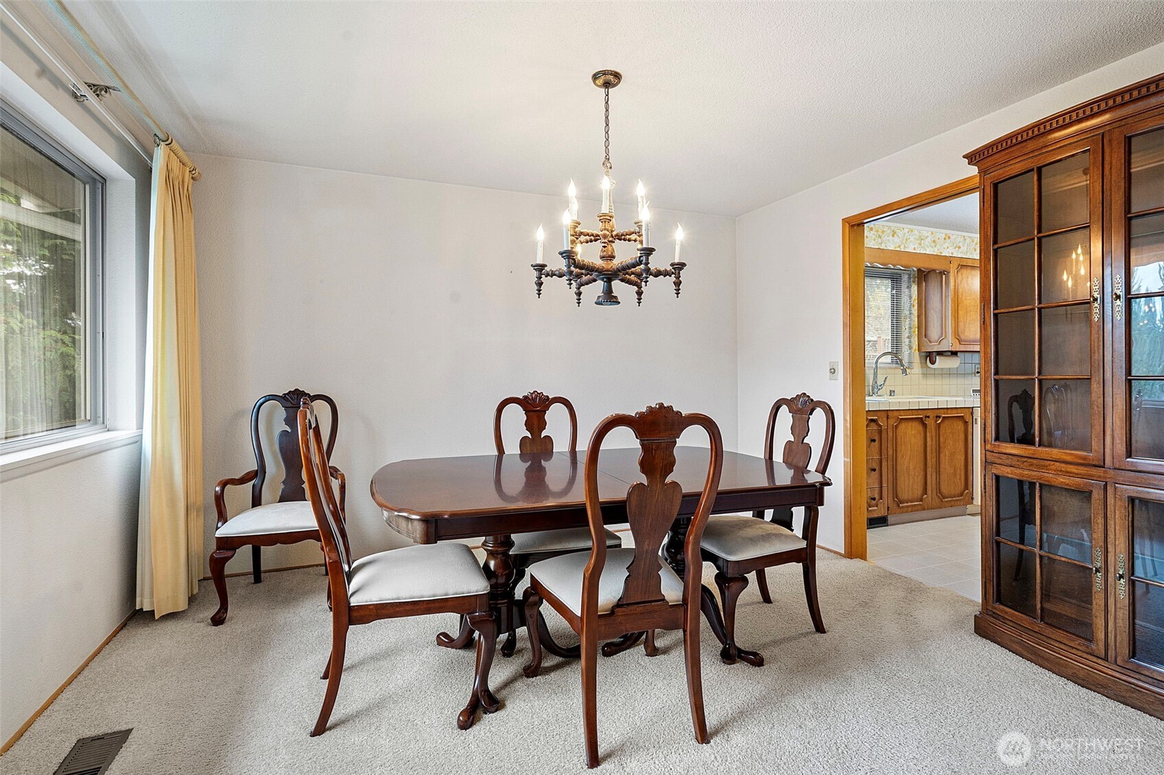 906 Forrest Park Drive Fircrest, WA 98466 - Photo 15 of 37 a dining room with furniture a chandelier and wooden floor