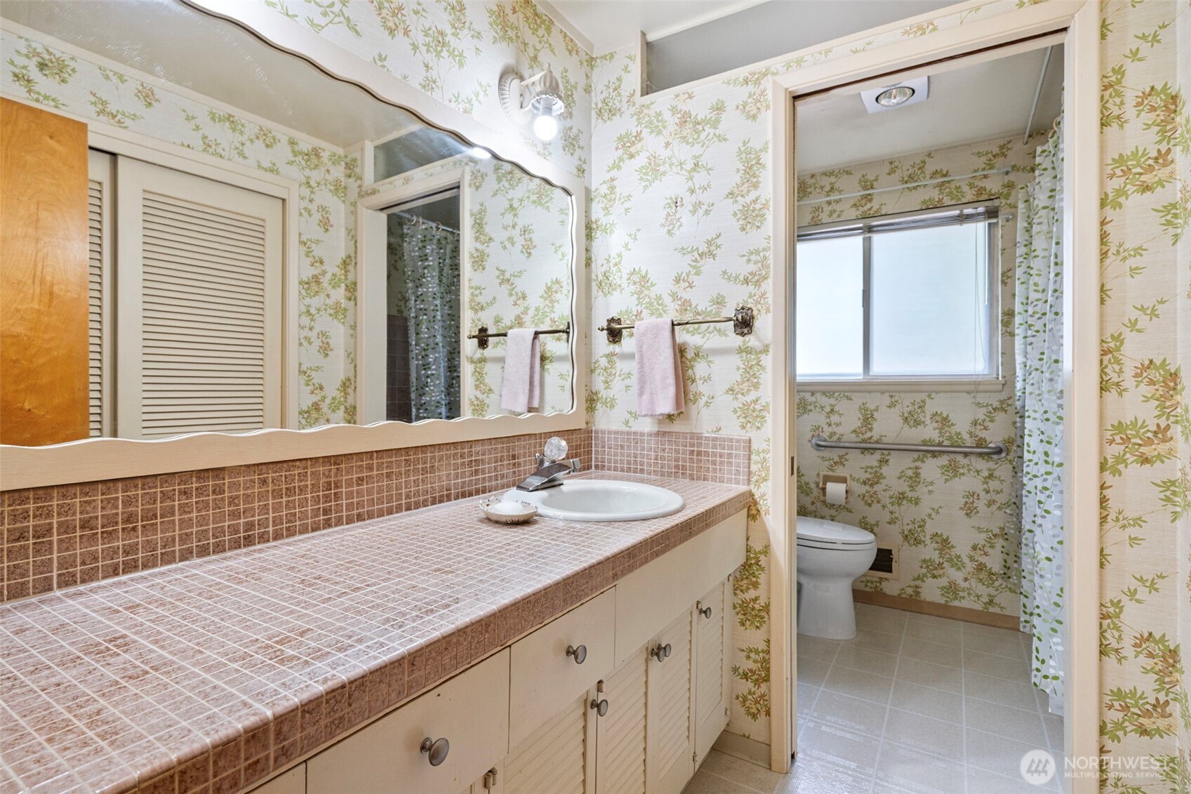 906 Forrest Park Drive Fircrest, WA 98466 - Photo 19 of 37 a bathroom with a sink a toilet and shower