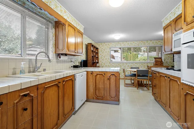 a view of a kitchen with granite countertop lots of counter top space