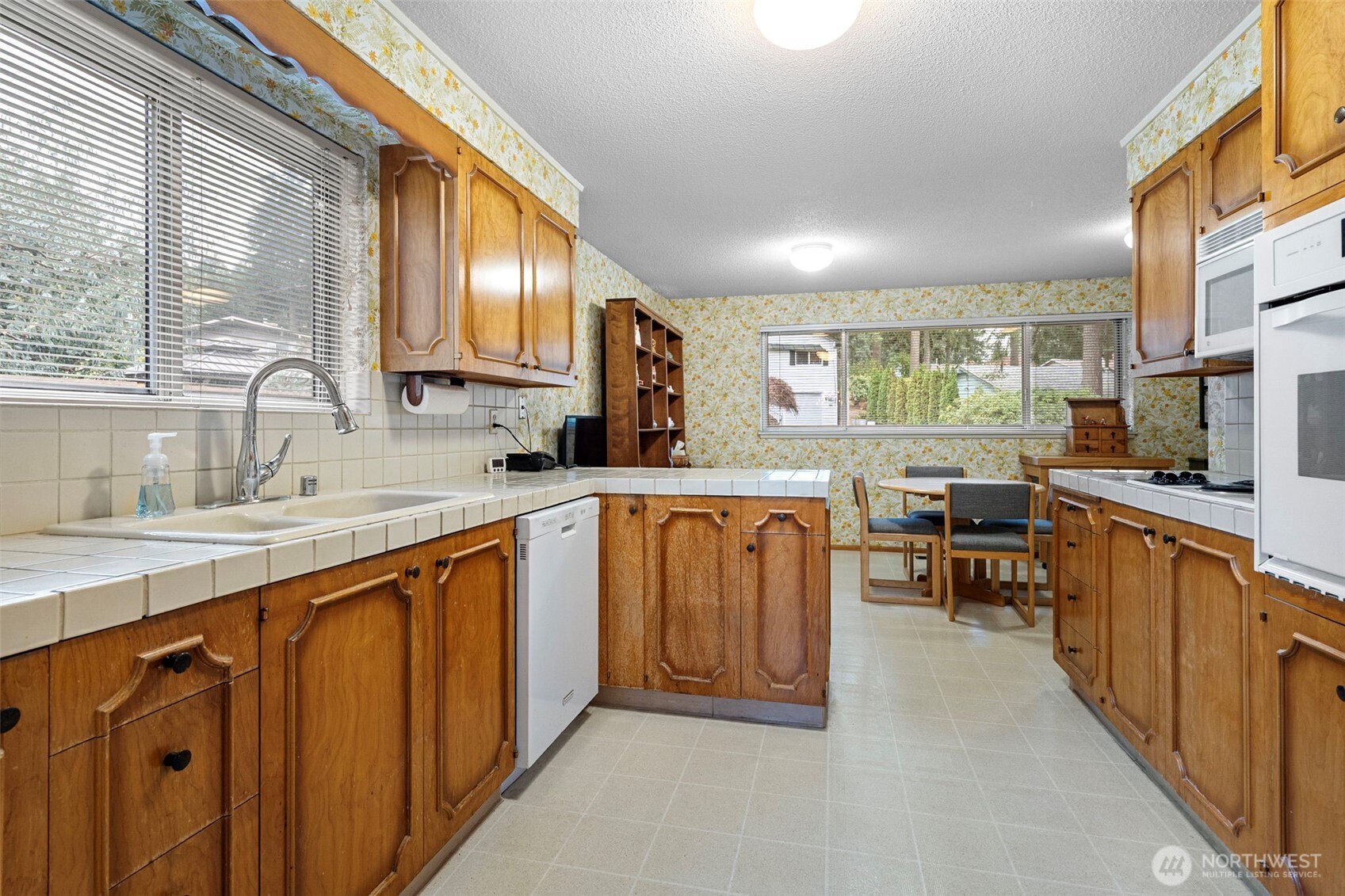 906 Forrest Park Drive Fircrest, WA 98466 - Photo 5 of 37 a view of a kitchen with granite countertop lots of counter top space