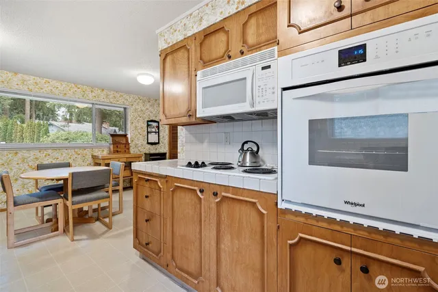 a kitchen with a stove and a microwave