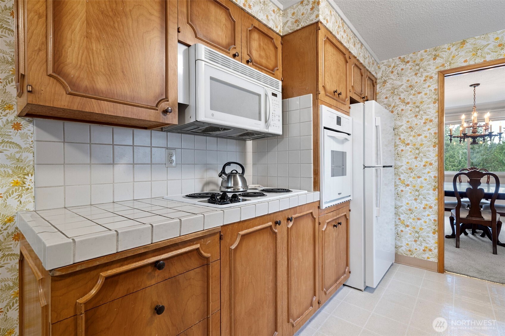 906 Forrest Park Drive Fircrest, WA 98466 - Photo 7 of 37 a kitchen with stainless steel appliances granite countertop a sink a stove and refrigerator