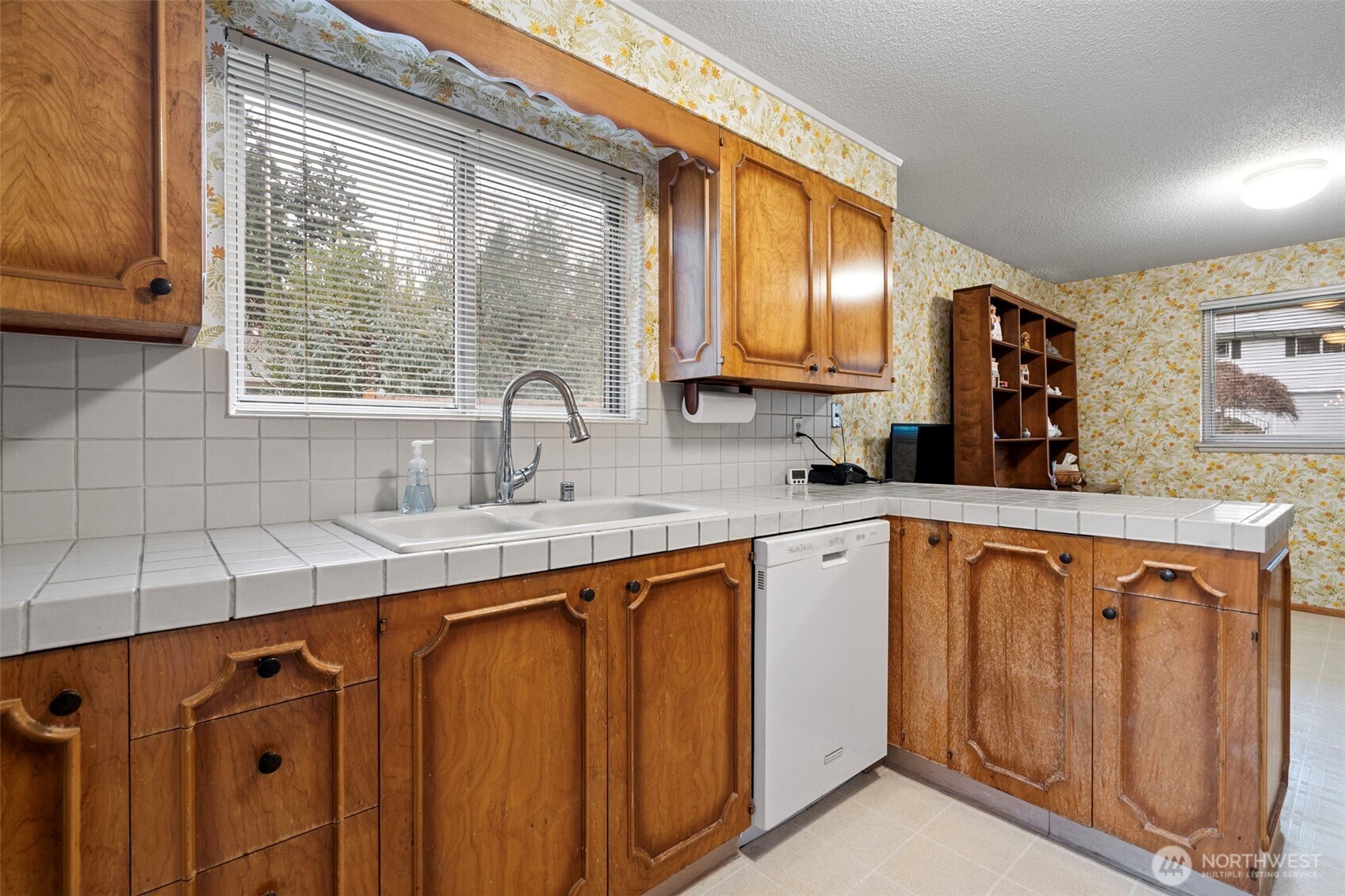 906 Forrest Park Drive Fircrest, WA 98466 - Photo 8 of 37 a kitchen with stainless steel appliances granite countertop a sink and a cabinets