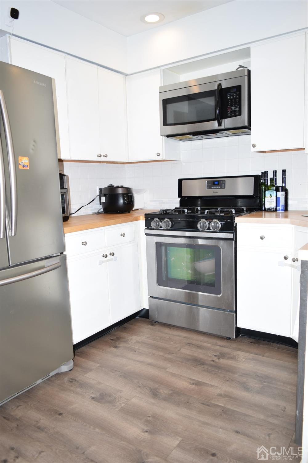 186 Nebula Road Piscataway, NJ 08854 - Photo 10 of 17 a kitchen with stainless steel appliances a stove a microwave and sink