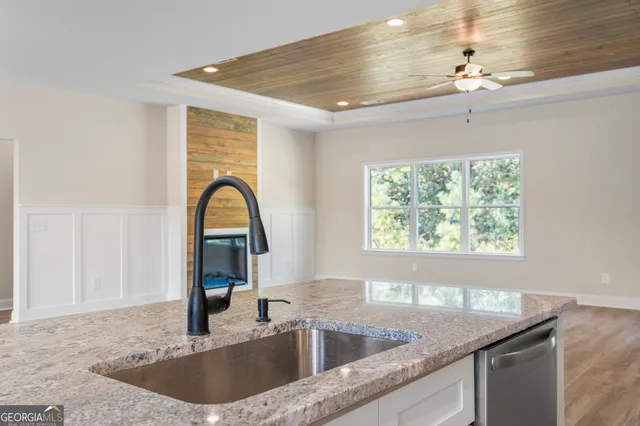 a kitchen with a sink and a window