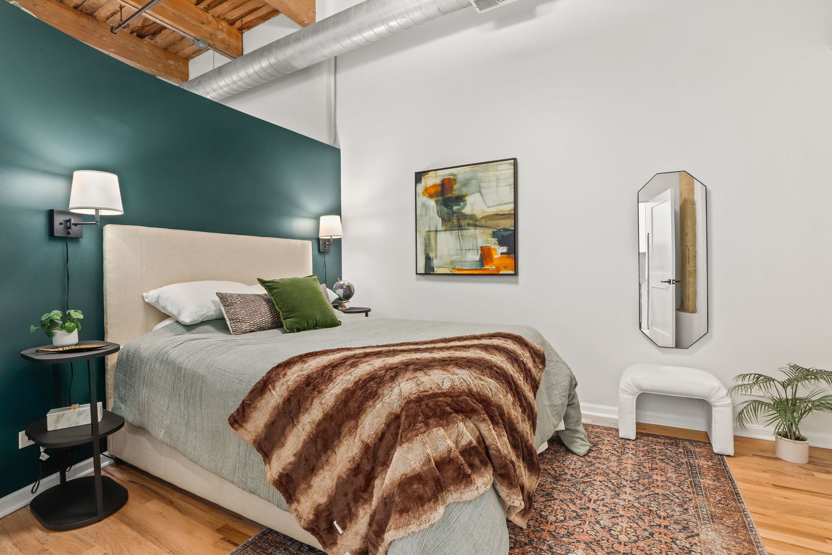 215 North Aberdeen Street, Unit 202B Chicago, IL 60607 - Photo 14 of 19 a bedroom with a bed and painting on the wall