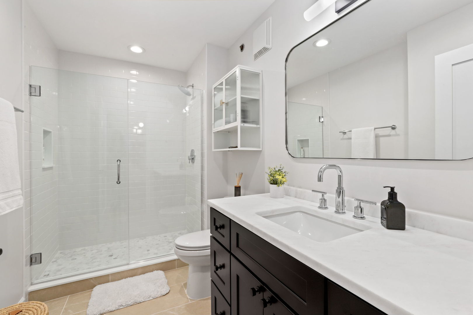215 North Aberdeen Street, Unit 202B Chicago, IL 60607 - Photo 16 of 19 a bathroom with a sink and a mirror