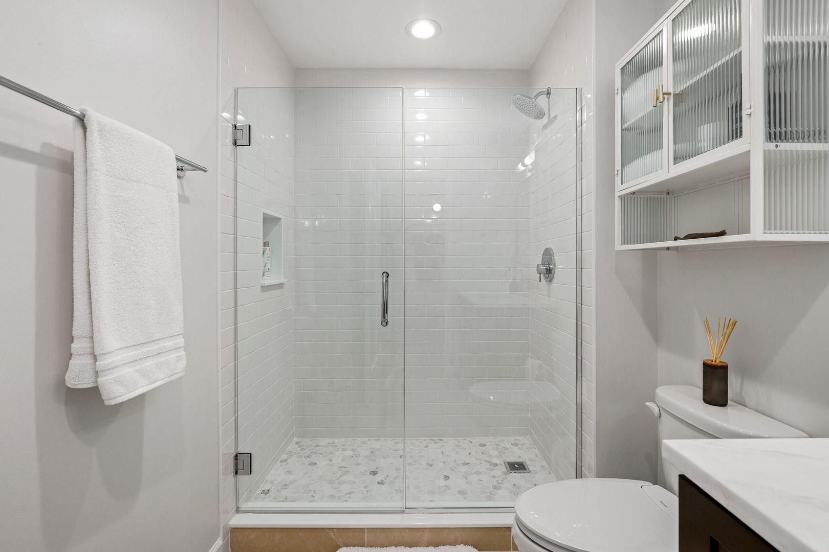 215 North Aberdeen Street, Unit 202B Chicago, IL 60607 - Photo 17 of 19 a bathroom with a shower a toilet and a sink