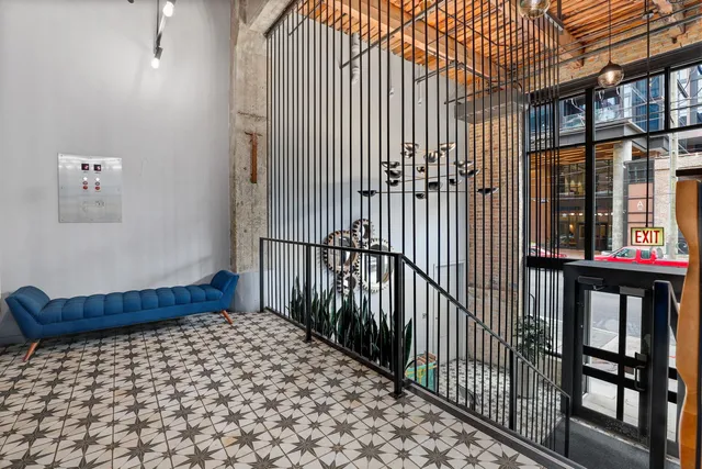 a bedroom with a bed and wall painting