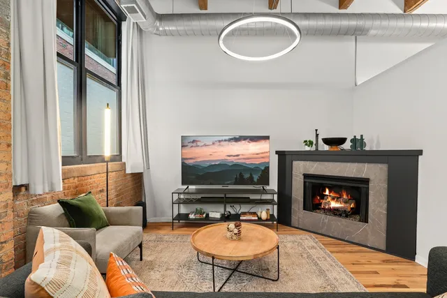 a kitchen with stainless steel appliances a stove a refrigerator and cabinets