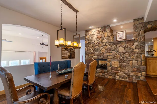 a dining room with furniture and a chandelier