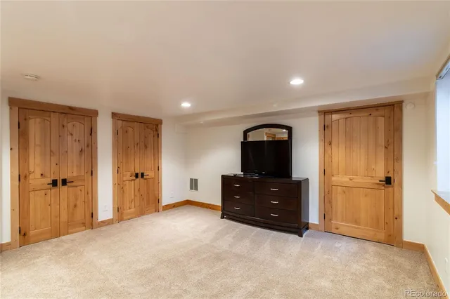 a room with a dresser and a mirror