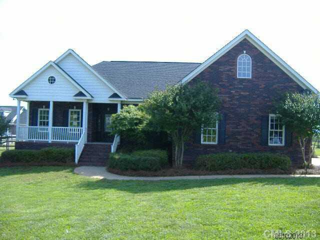 3827 Watson Church Road Monroe, NC 28110 - Photo 1 of 16 a front view of a house with garden