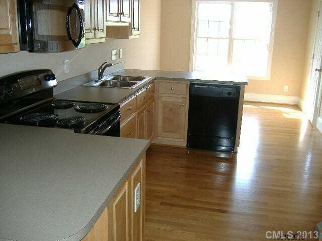 3827 Watson Church Road Monroe, NC 28110 - Photo 3 of 16 a kitchen with granite countertop a stove and a sink