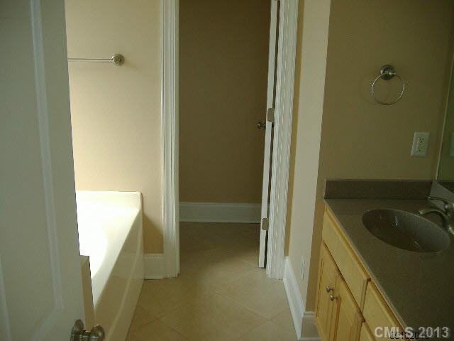 3827 Watson Church Road Monroe, NC 28110 - Photo 8 of 16 a bathroom with a sink a toilet and shower