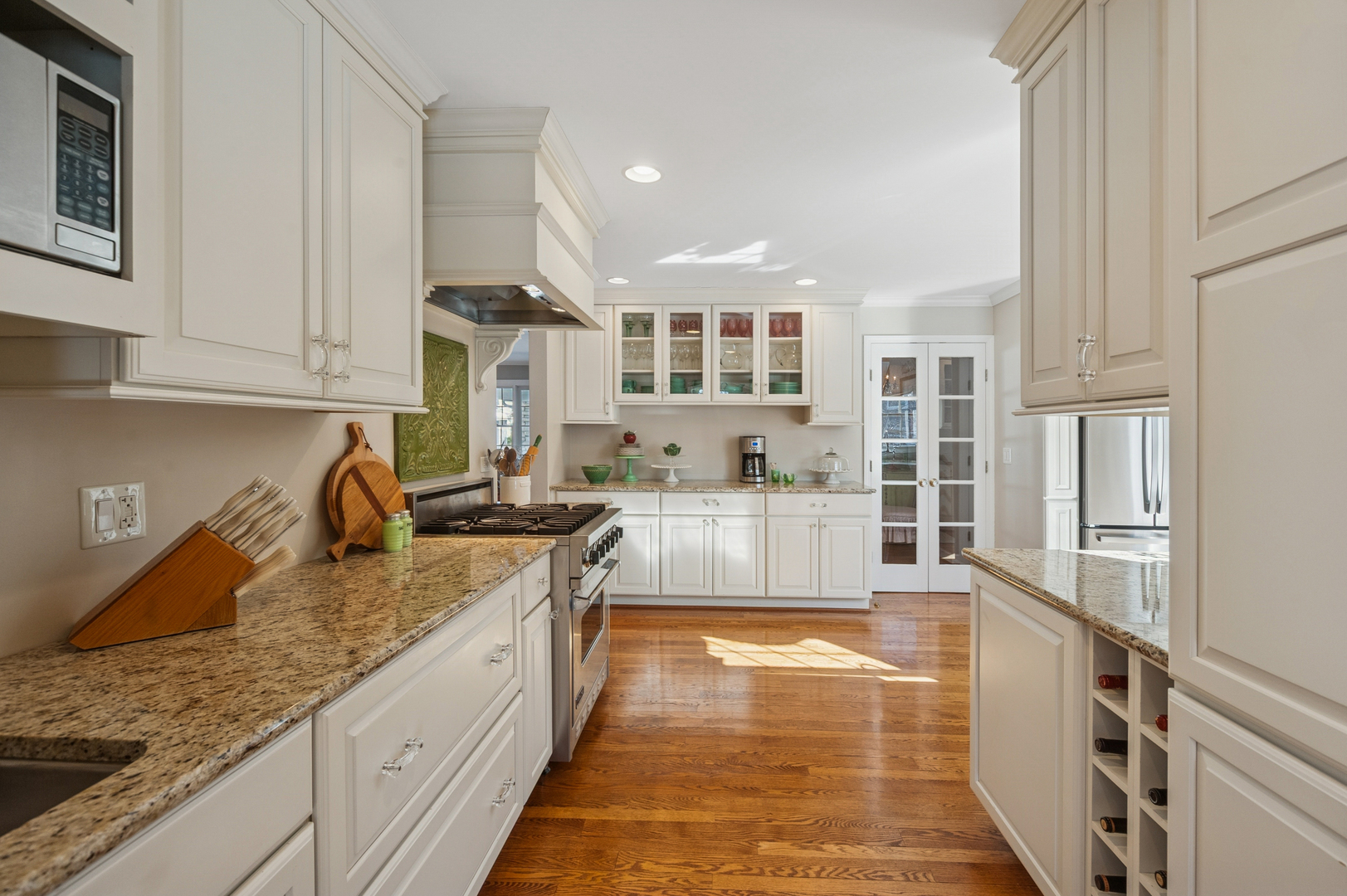 706 Cherry Court Itasca, IL 60143 - Photo 17 of 43 a large kitchen with granite countertop a stove and a sink