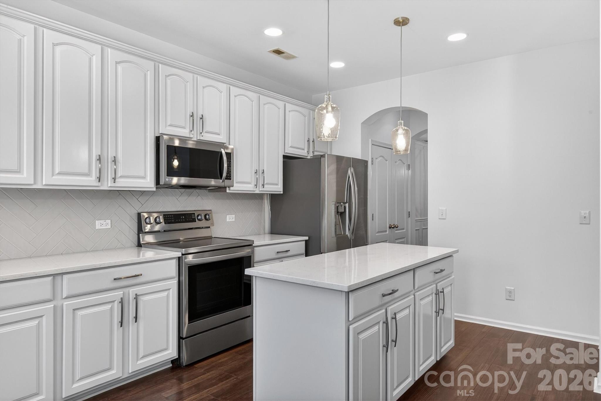 5527 Cactus Valley Road, Unit 183 Charlotte, NC 28277 - Photo 12 of 47 a kitchen with a sink a microwave a refrigerator and cabinets