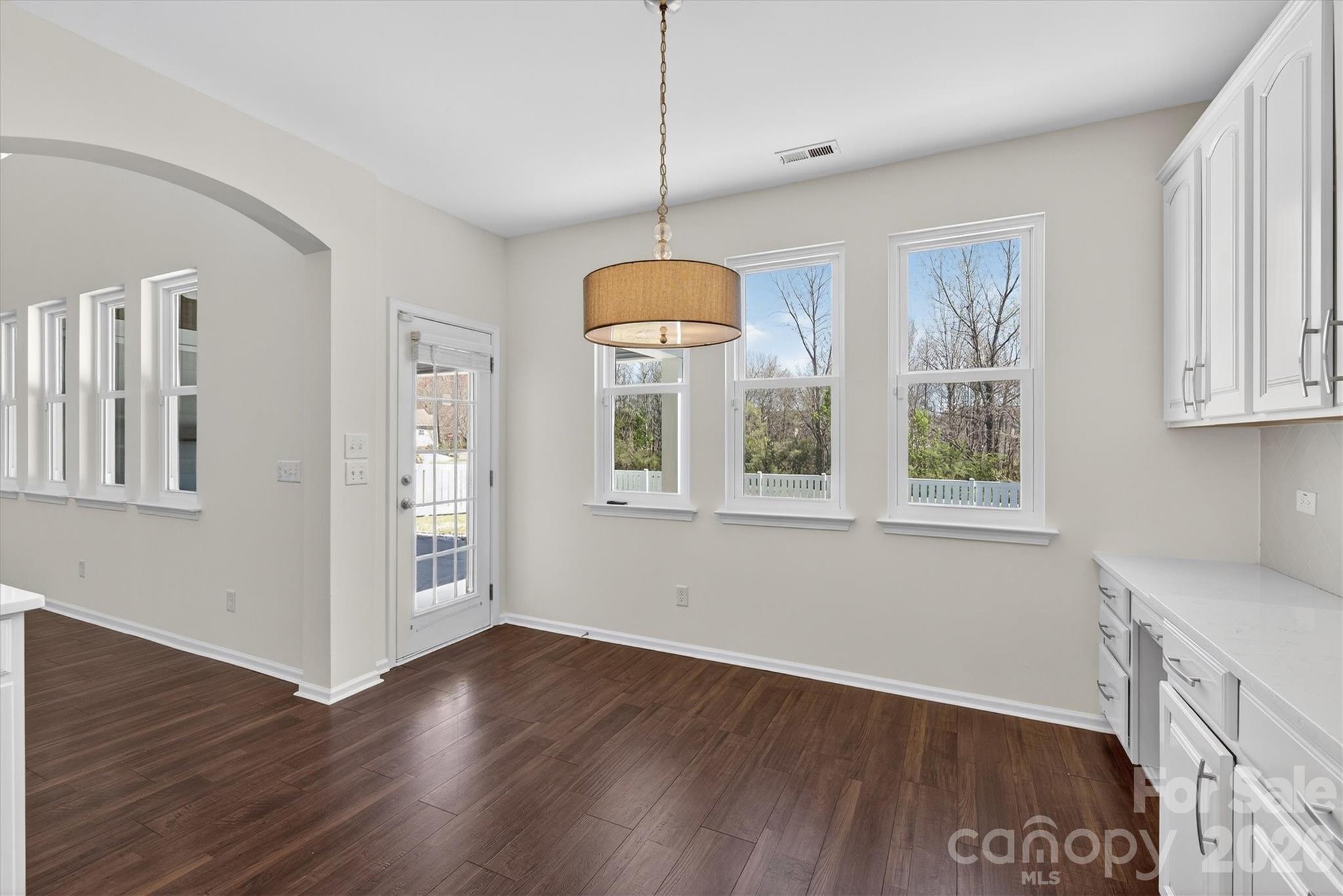 5527 Cactus Valley Road, Unit 183 Charlotte, NC 28277 - Photo 13 of 47 a view of an empty room with window and wooden floor
