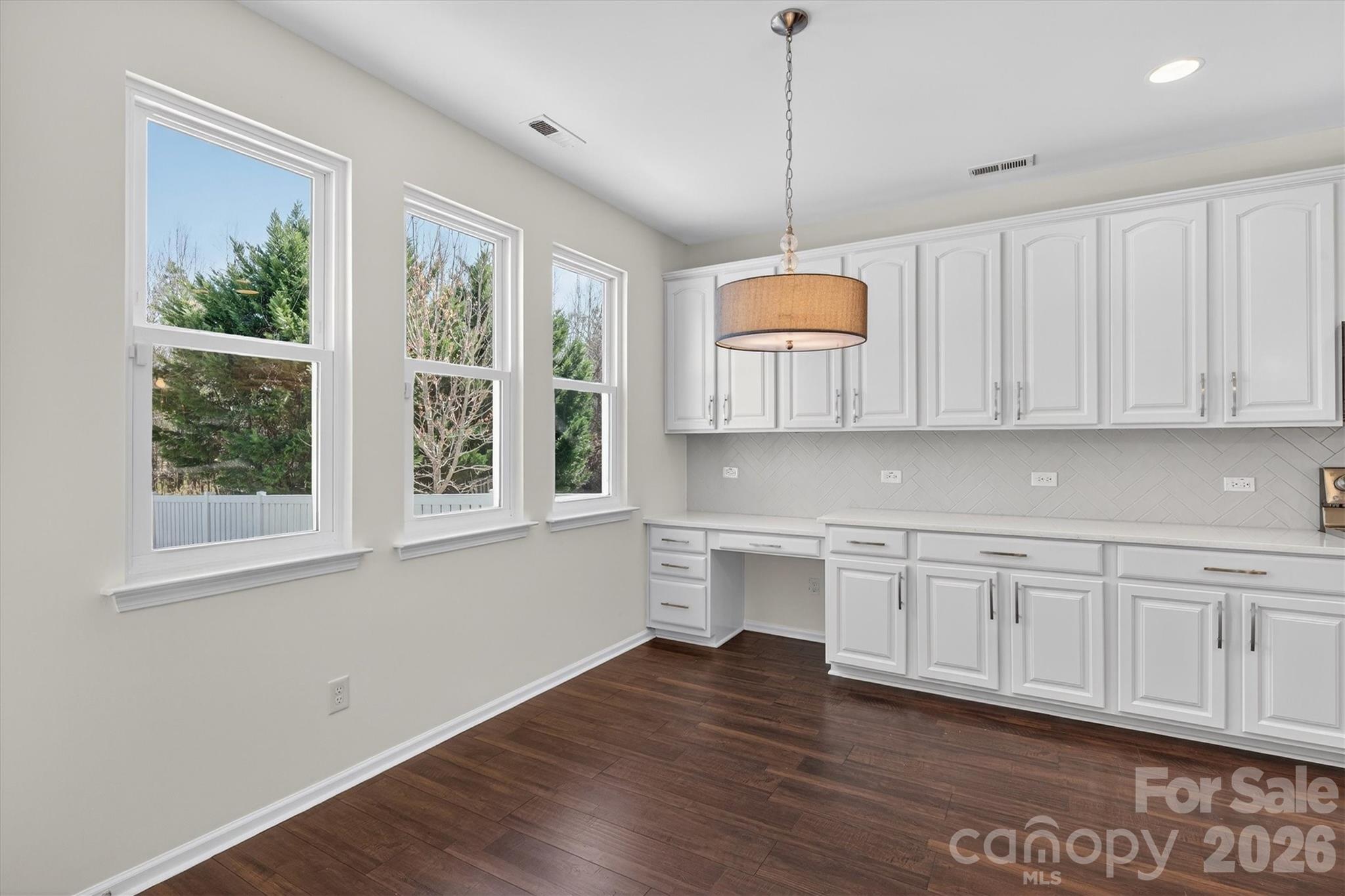 5527 Cactus Valley Road, Unit 183 Charlotte, NC 28277 - Photo 16 of 47 a kitchen with white cabinets and window