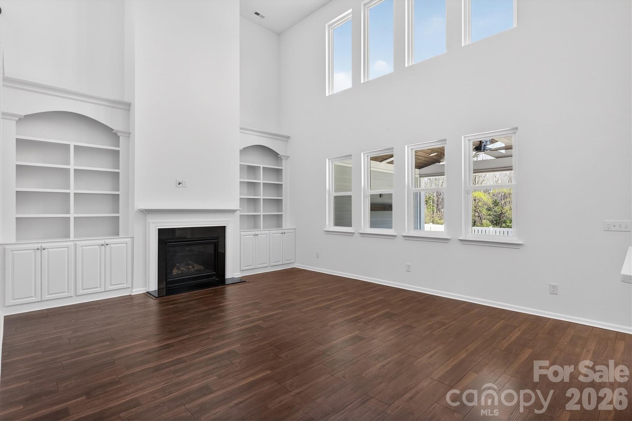 5527 Cactus Valley Road, Unit 183 Charlotte, NC 28277 - Photo 17 of 47 an empty room with windows and fireplace