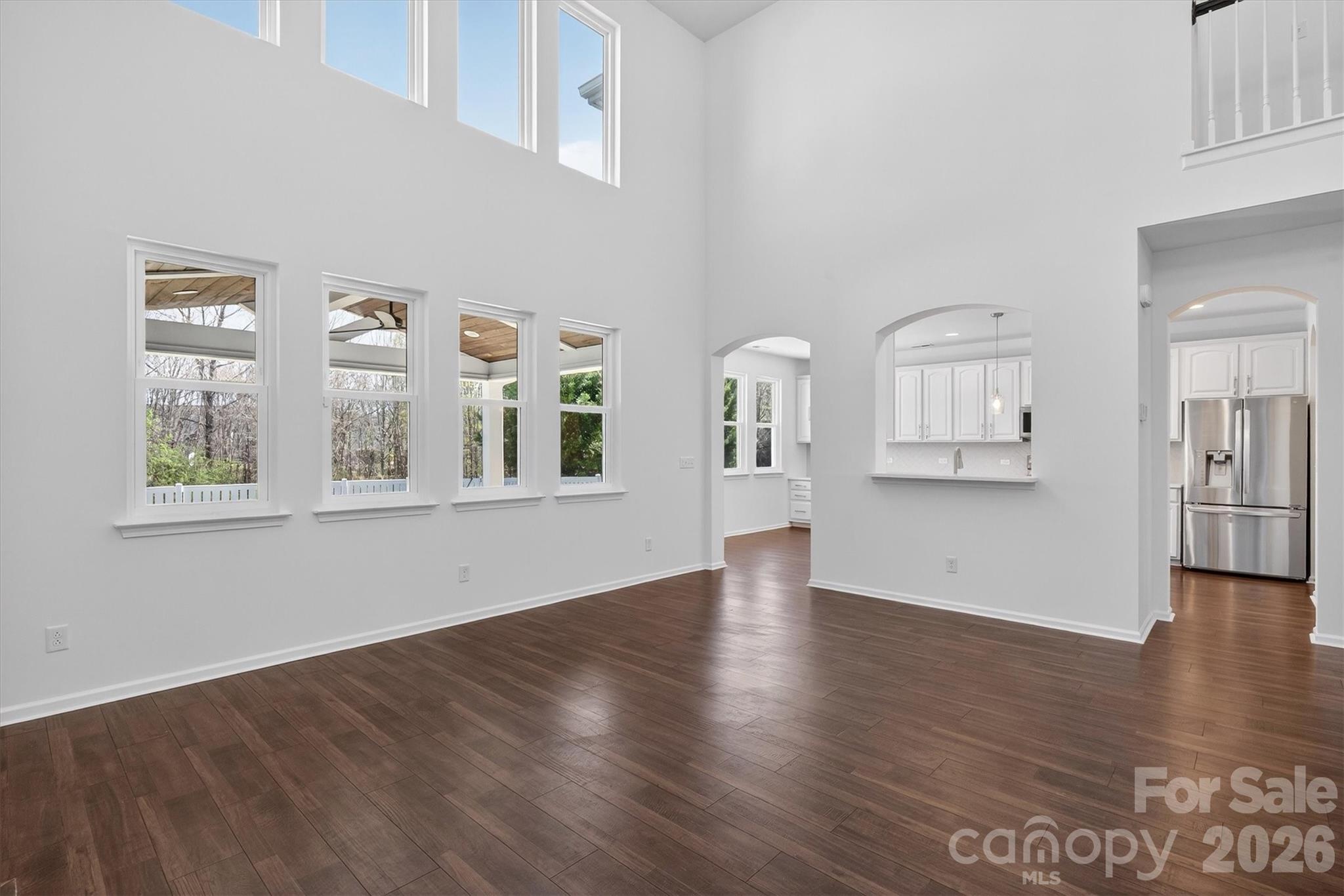 5527 Cactus Valley Road, Unit 183 Charlotte, NC 28277 - Photo 20 of 47 a view of an empty room with wooden floor and a window