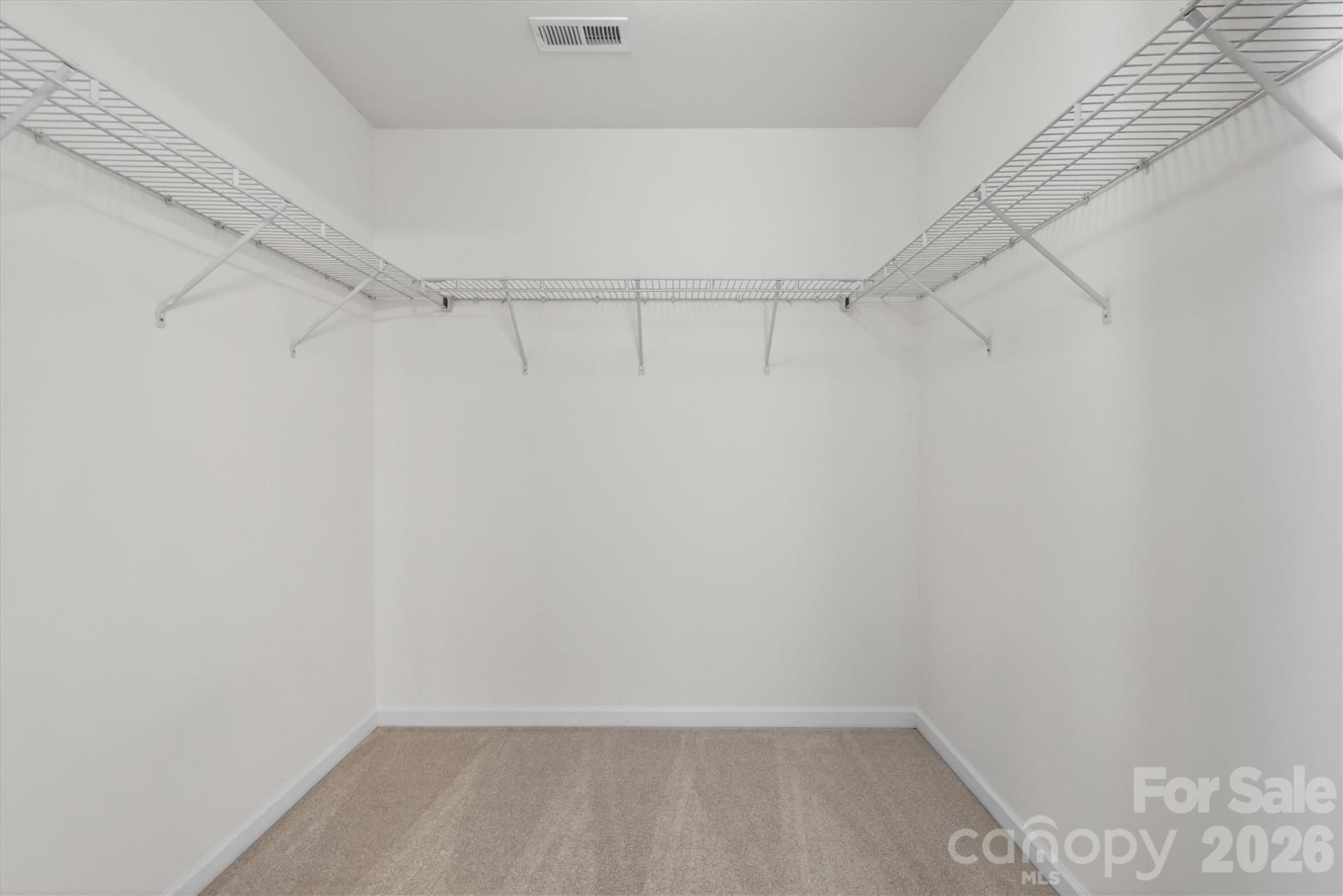 5527 Cactus Valley Road, Unit 183 Charlotte, NC 28277 - Photo 30 of 47 a view of a room with racks on the wall