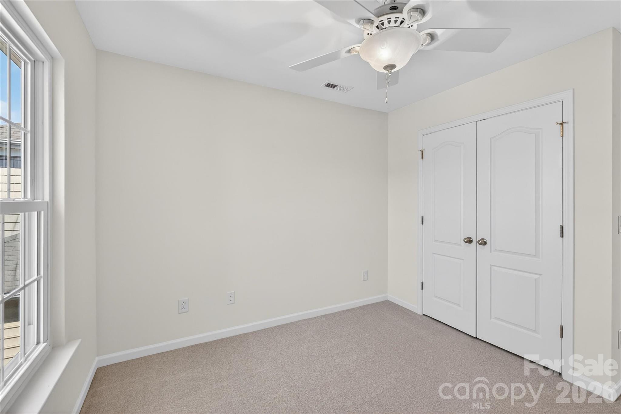 5527 Cactus Valley Road, Unit 183 Charlotte, NC 28277 - Photo 32 of 47 wooden floor in an empty room with a window