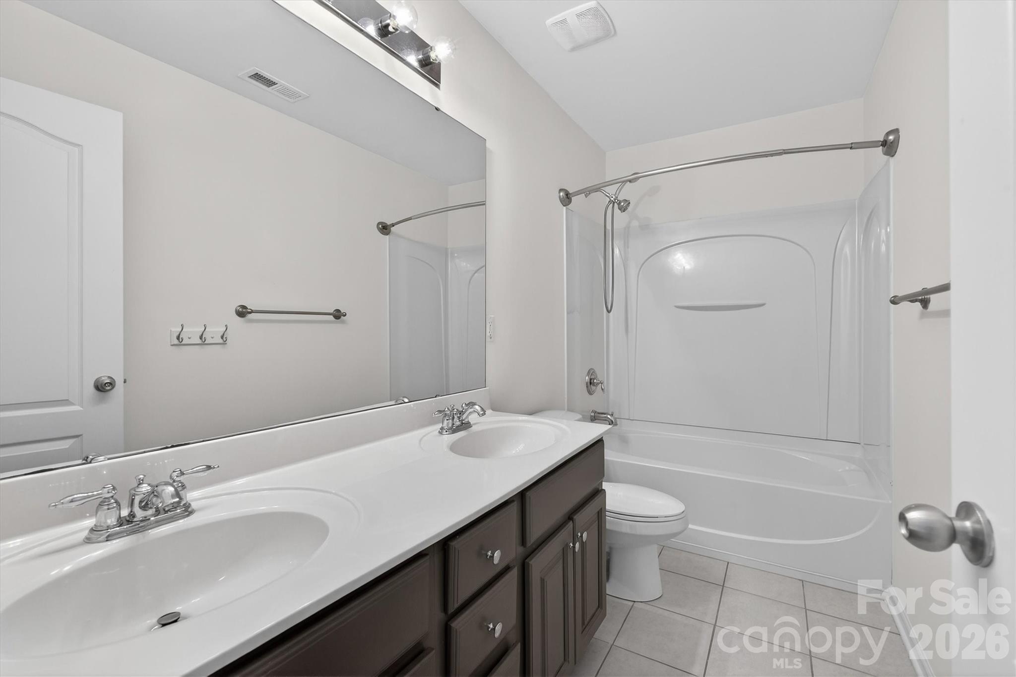 5527 Cactus Valley Road, Unit 183 Charlotte, NC 28277 - Photo 34 of 47 a bathroom with a granite countertop sink a toilet and shower