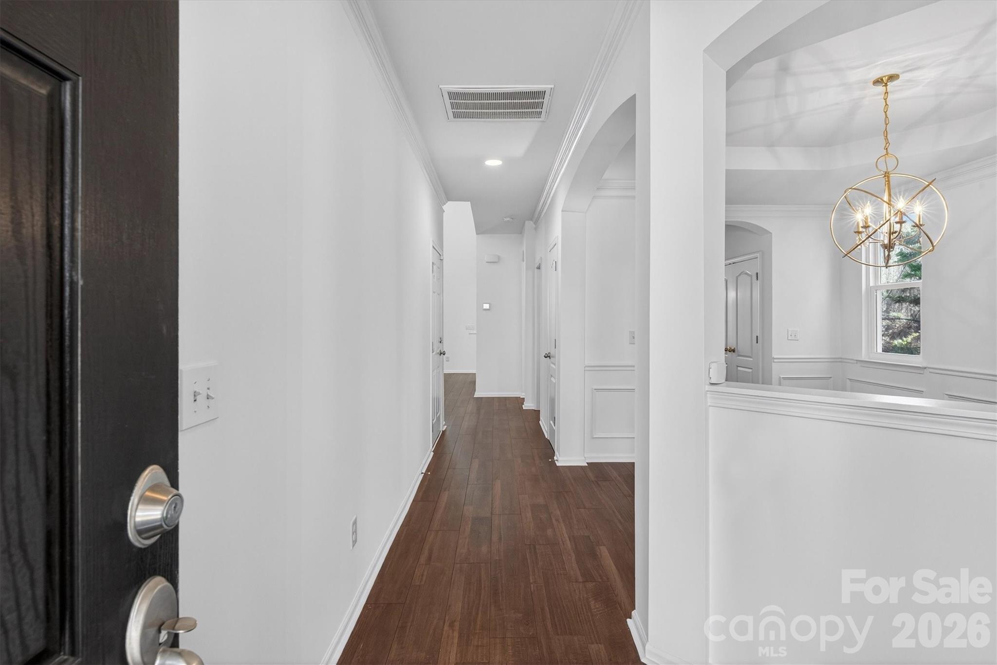 5527 Cactus Valley Road, Unit 183 Charlotte, NC 28277 - Photo 5 of 47 a view of a hallway with wooden floor and staircase