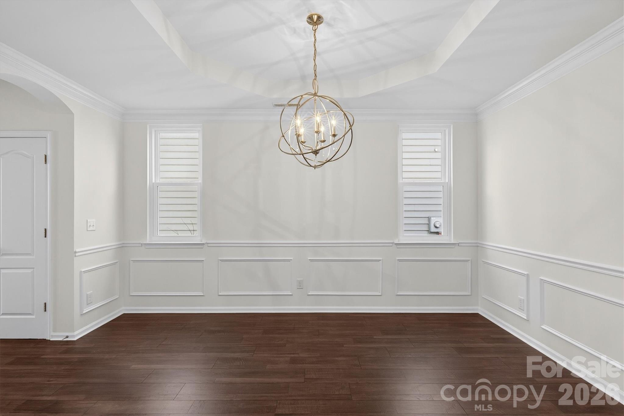 5527 Cactus Valley Road, Unit 183 Charlotte, NC 28277 - Photo 8 of 47 a view of empty room with wooden floor and fan
