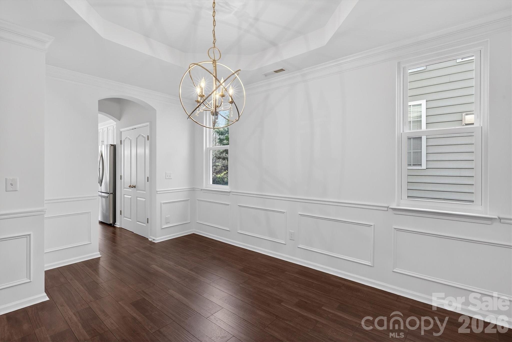 5527 Cactus Valley Road, Unit 183 Charlotte, NC 28277 - Photo 9 of 47 a view of empty room with wooden floor and fan