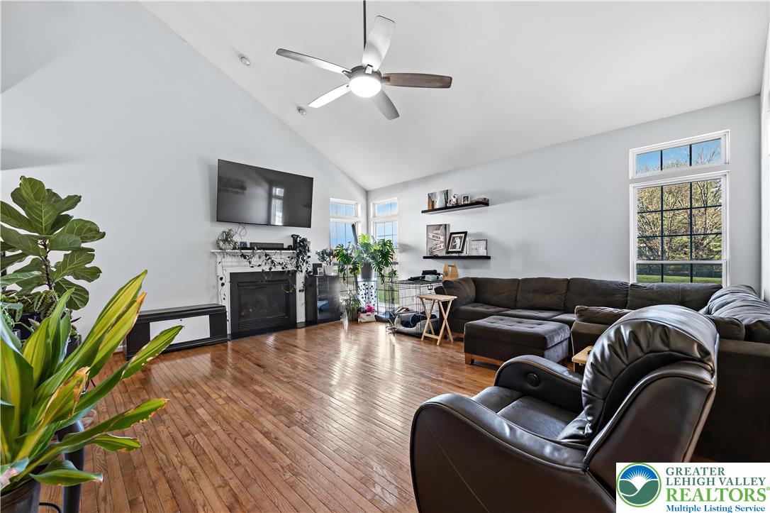 130 Lower Way Road Easton, PA 18045 - Photo 7 of 56 a living room with furniture a flat screen tv and a potted plant