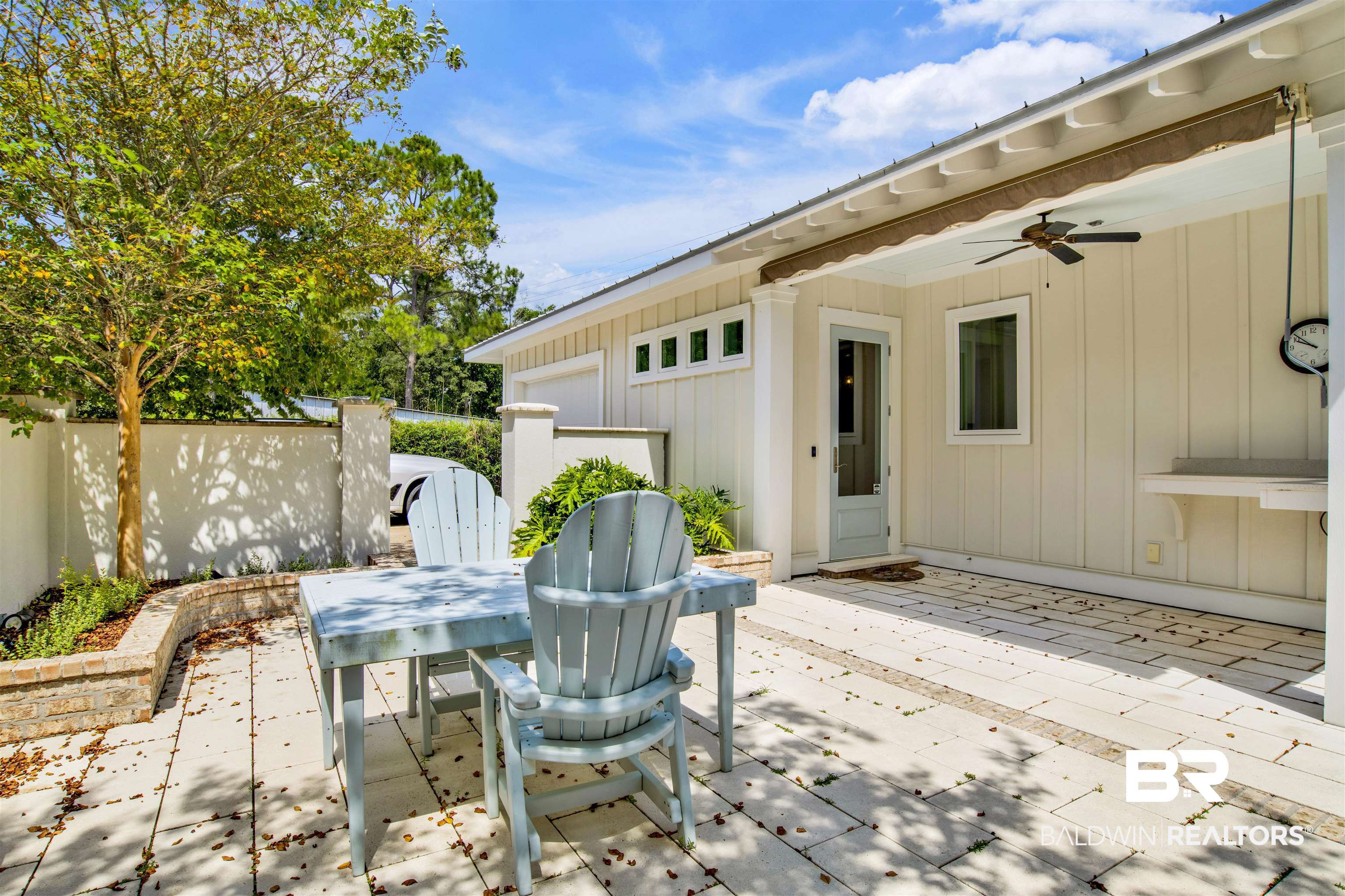 27980 Canal Road Orange Beach, AL 36561 - Photo 11 of 46 View of patio featuring outdoor dining area, ceiling fan, and a gate