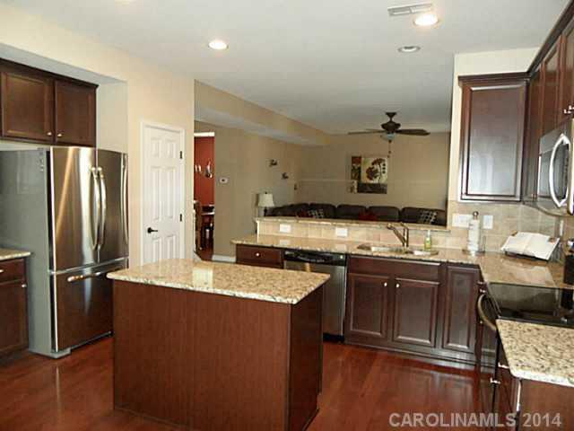 1018 Oakmere Road Waxhaw, NC 28173 - Photo 4 of 16 a kitchen with stainless steel appliances granite countertop a sink stove and refrigerator