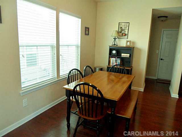 1018 Oakmere Road Waxhaw, NC 28173 - Photo 5 of 16 a view of a dining room with furniture and wooden floor