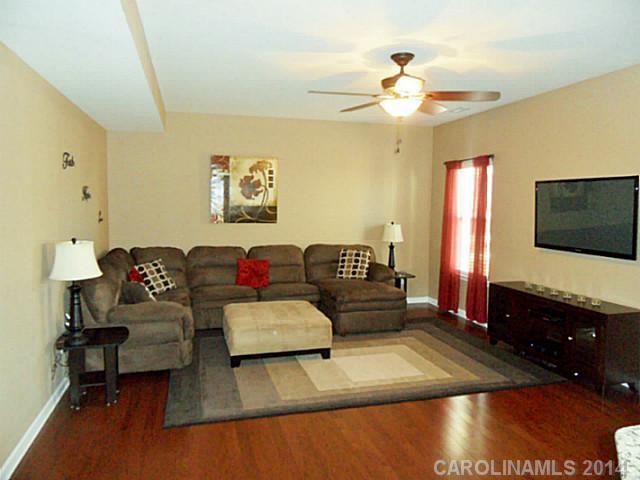 1018 Oakmere Road Waxhaw, NC 28173 - Photo 6 of 16 a living room with furniture and a flat screen tv