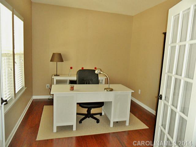 1018 Oakmere Road Waxhaw, NC 28173 - Photo 8 of 16 a work place with furniture and wooden floor