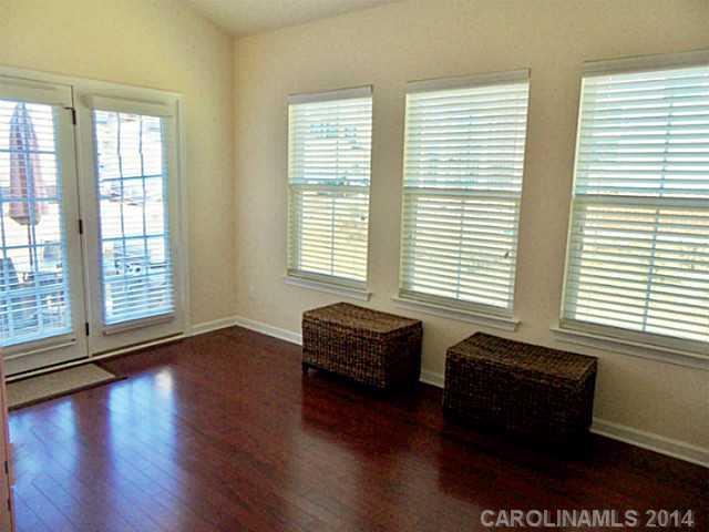 1018 Oakmere Road Waxhaw, NC 28173 - Photo 9 of 16 a room with wooden floor and a window