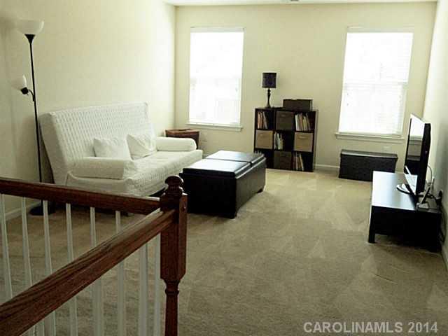 1018 Oakmere Road Waxhaw, NC 28173 - Photo 10 of 16 a living room with furniture and a window