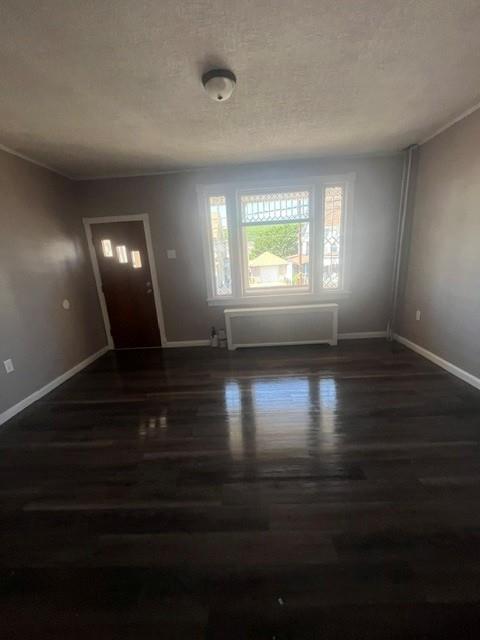 126 East High Street Coaldale, PA 18218 - Photo 3 of 15 Richly toned hardwood flooring and a brightly lit window define this welcoming living space.