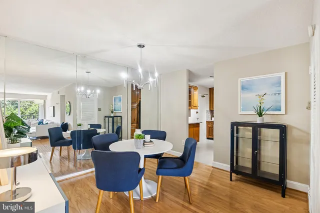 a view of a dining room with furniture and wooden floor