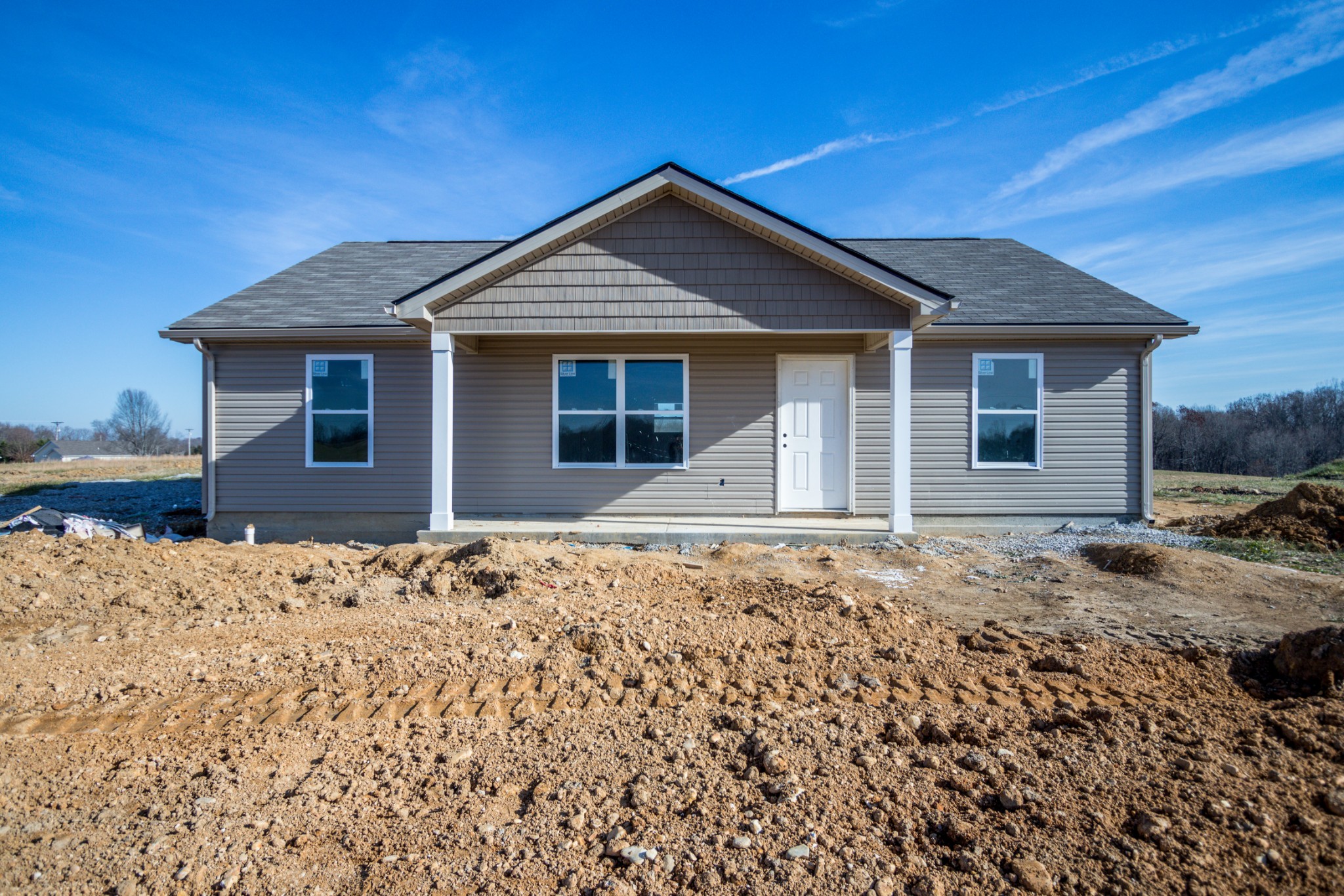 3068 Maple Grove Road Dickson, TN 37055 - Photo 4 of 14 a front view of a house with a yard
