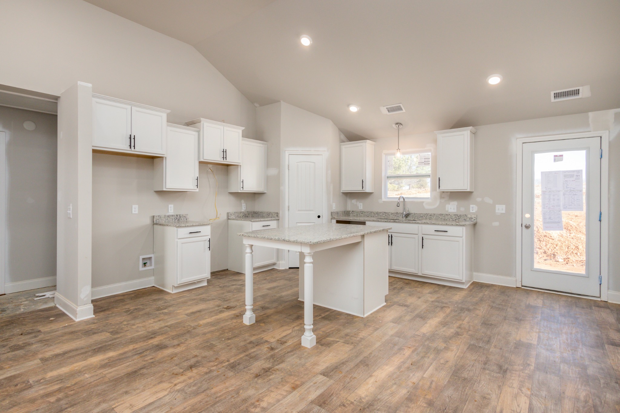 3068 Maple Grove Road Dickson, TN 37055 - Photo 5 of 14 a kitchen with white cabinets stove and white appliances