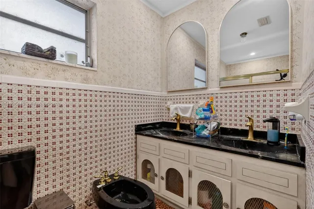 a bathroom with a glass shower door